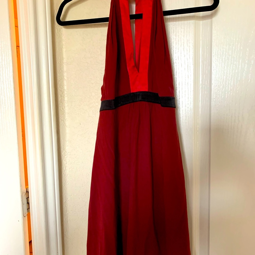 It is a casual mini evening dress once worn , it is a burgundy color